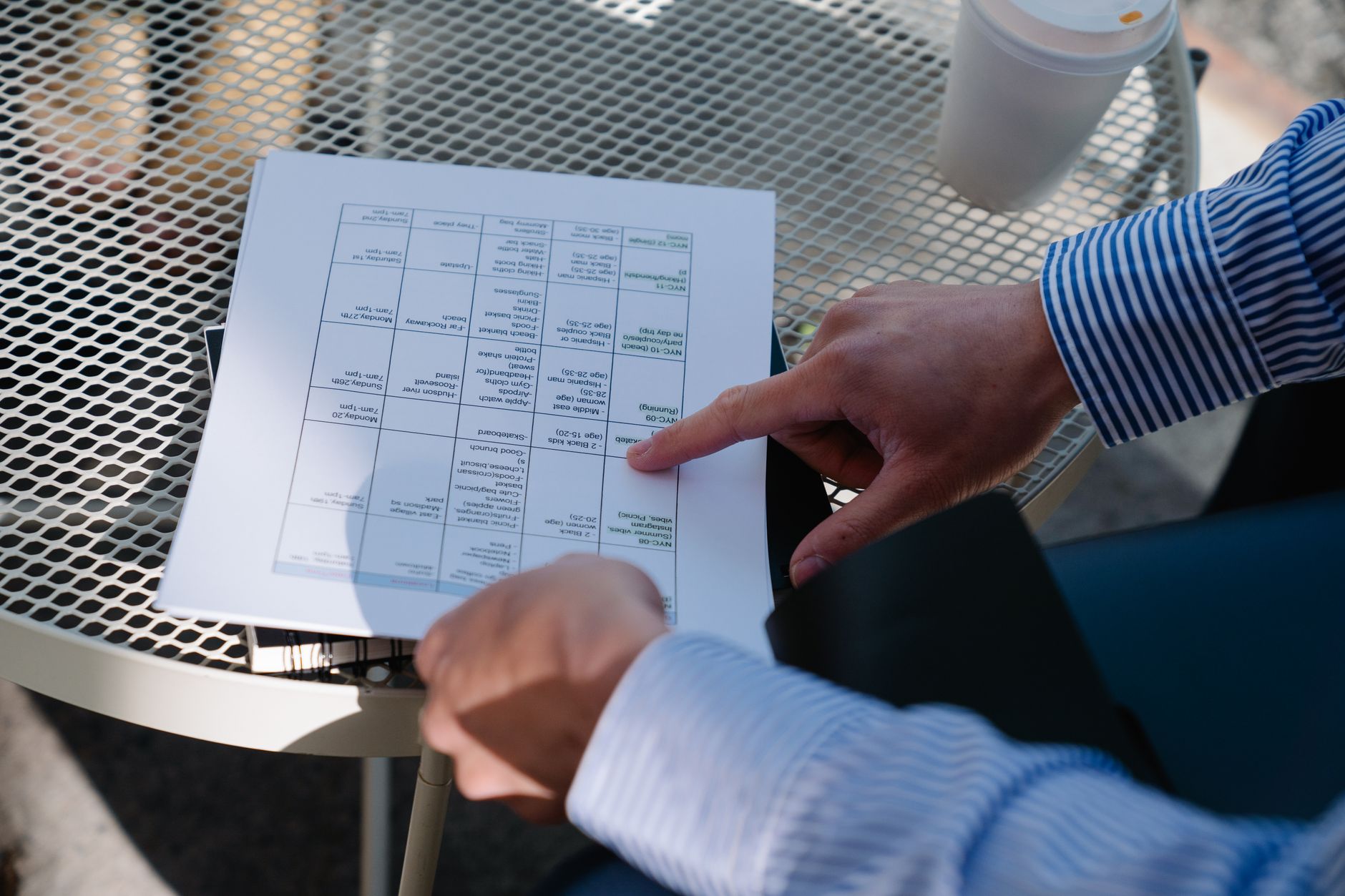Contractor and coordinator reviewing a schedule on site